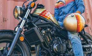 A model posing on top of a motorcycle
