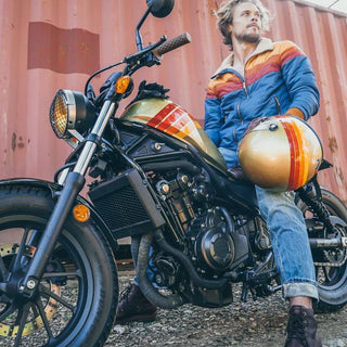 A model posing on top of a motorcycle