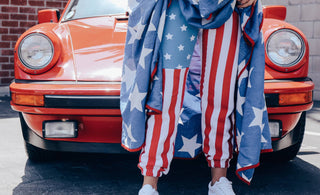 American flag sweatpants in-front of a car