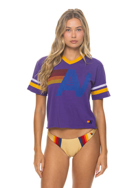 Aviator Nation Logo V-Neck Jersey Boyfriend Tee in deep purple with a white and gold logo