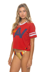 Red V-neck jersey boyfriend tee with a white Aviator Nation logo, relaxed tri-blend fit