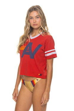 Red V-neck jersey boyfriend tee with a white Aviator Nation logo, relaxed tri-blend fit