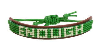Green and white beaded bracelet with 'Enough' on a white background