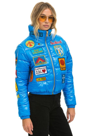 VINTAGE PATCH APRES PUFFER JACKET - BLUE CINA GLOSSY Women's Outerwear Aviator Nation 