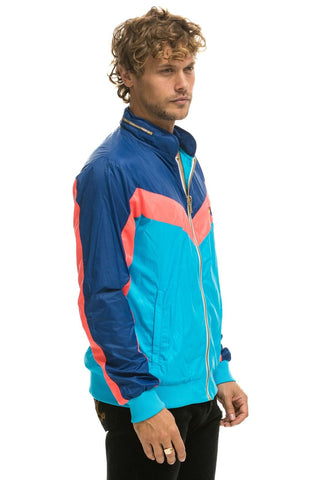 MEN'S WINDBREAKER JACKET- NEON BLUE Men's Windbreaker Aviator Nation 