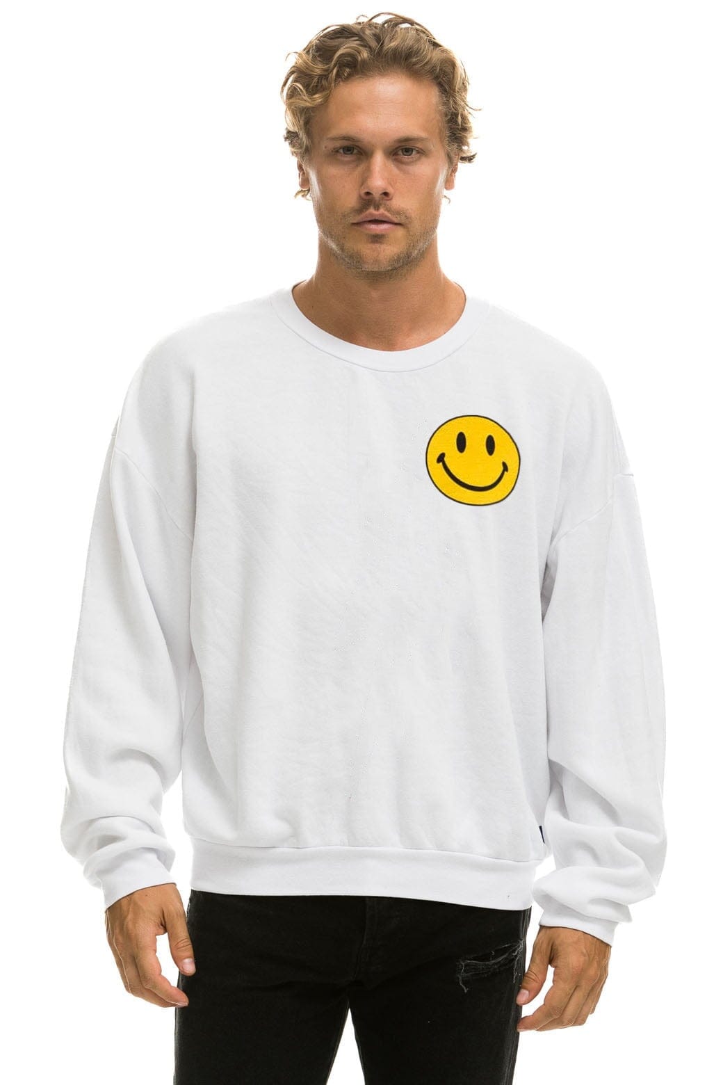 white sweatshirt with smiley face